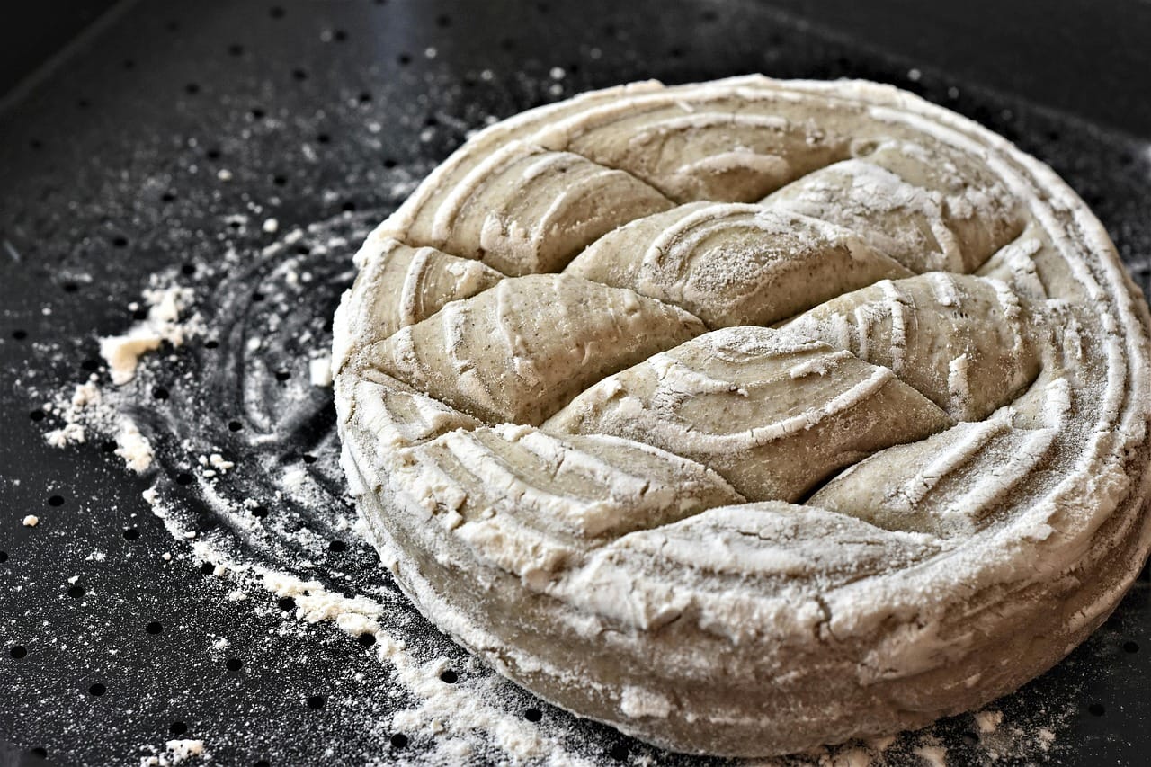 Day nine: the starter finally doubled, and a week later came the first loaf worth eating. I named the starter after my grandfather.