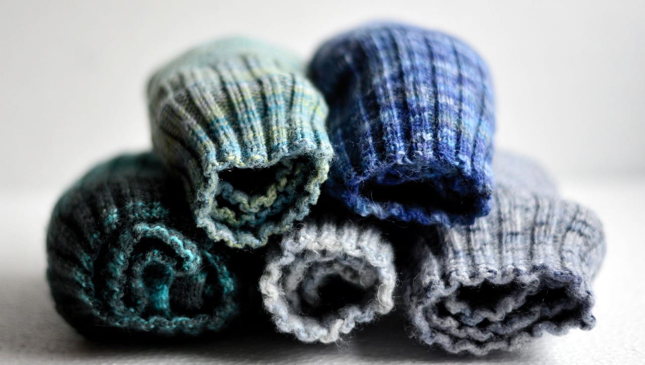 Three socks, three darns. The one on the left was my first, and it shows.