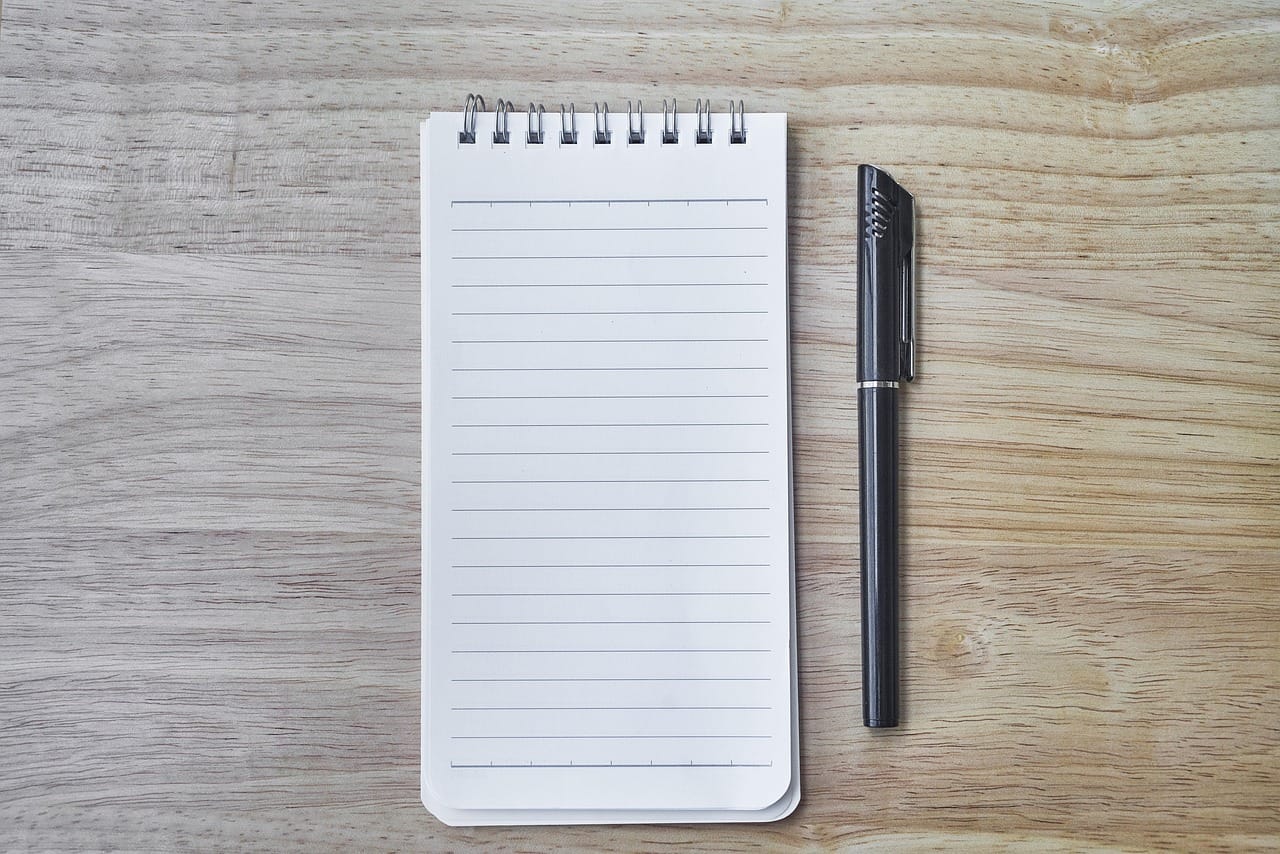 A pencil in the margin: a line, a question mark, a word.